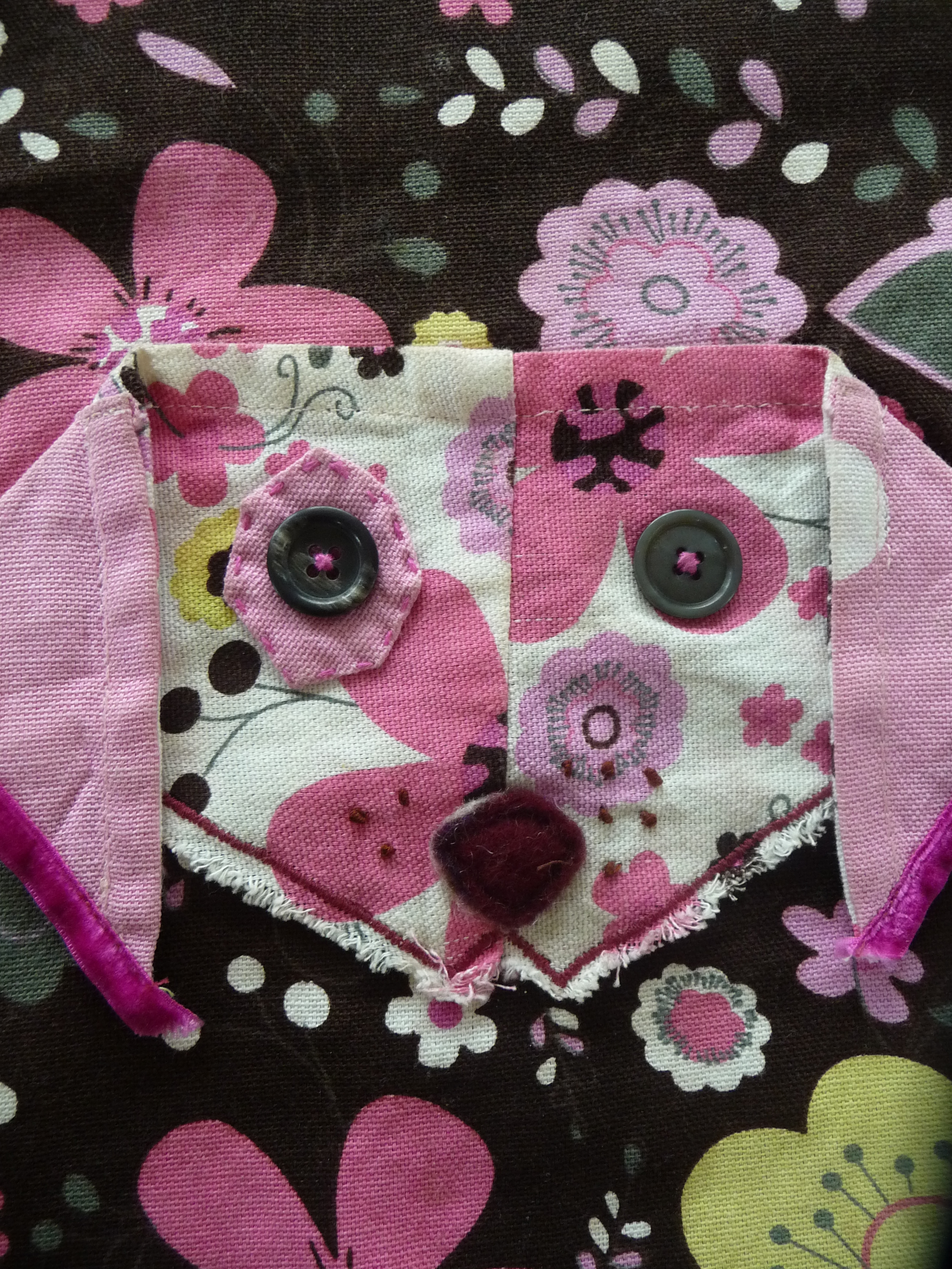 Sewing Dog face to decorate apron.